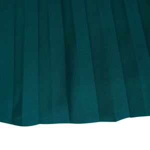 Macro shot of dark green pleated fabric texture with uniform vertical pleats