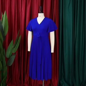Detail of royal blue V-neck dress featuring pleated skirt and ruffled short sleeves