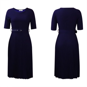 Detail view of navy blue short sleeve pleated dress with matching belted waist and crew neck