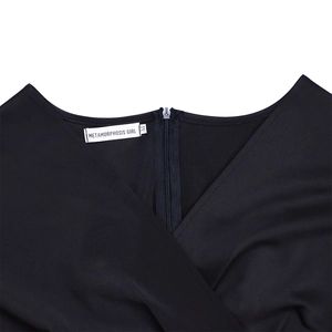 Detail of elegant V-neckline with invisible back zipper on black A-line evening dress