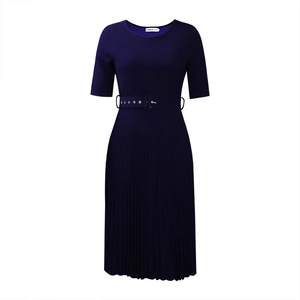 Detail of navy blue pleated dress featuring short sleeves and matching waist belt