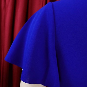 Detail of royal blue flutter sleeves on a V-neck pleated plus size dress for women