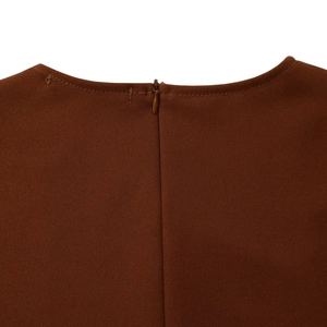 Detailed close-up of seamless invisible zipper and stitching on a dark brown dress neck