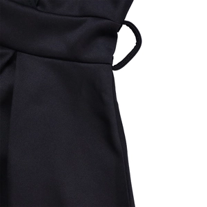 Close-up of waist belt loops and premium stitching on a black V-neck maxi dress