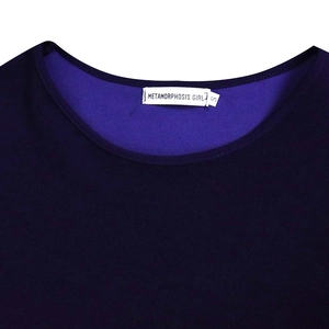 Detailed close-up of the round neckline with brand label and size tag on a navy dress