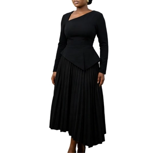 Detailed view of elegant black midi dress with asymmetric neckline and pleated skirt