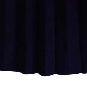 Macro detail of navy blue pleated fabric with vertical folds on a flared midi dress