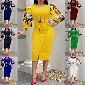 Detail of elegant V-neck midi dress featuring ethnic pattern puff sleeves and front slit