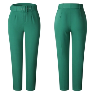 Front and back view of green high-waisted dress pants with a matching wide belt