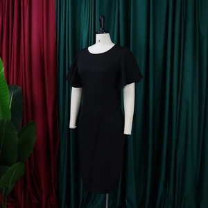 Close-up of black slim fit dress featuring elegant ruffle sleeves and round neckline