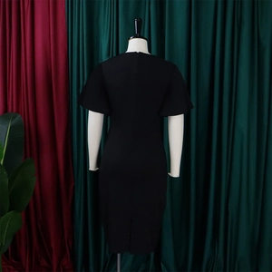 Rear view of a slim black dress featuring a high-quality back zipper and a back slit detail
