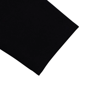 Macro view of double-needle stitching and high-quality knit texture on black dress