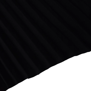 Detailed view of elegant black micro-pleated fabric texture for long dresses