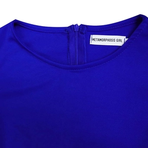 Detailed back view of a navy blue dress with a high-quality invisible zipper and brand label
