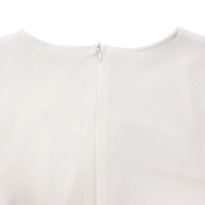 Close-up of the elegant back neckline with a seamless invisible zipper on the white dress