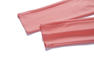 Detailed close-up showing the professional double-needle hem of these pink trousers