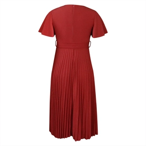 Detail view of the deep red pleated dress featuring a back zipper and ruffled sleeves