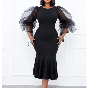 Elegant black bodycon dress with sheer organza puff sleeves and ruffled mermaid hemline