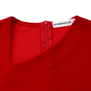 Detail of red elegant dress featuring a secure invisible zipper and neat stitching