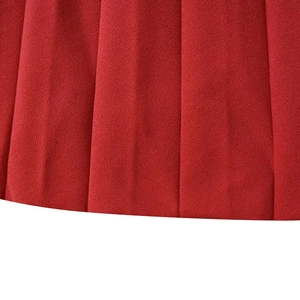 Detailed macro shot of high-quality red pleated fabric with elegant vertical textures