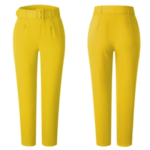 Detail view of high-waist yellow trousers with matching belt and sleek tailored fit