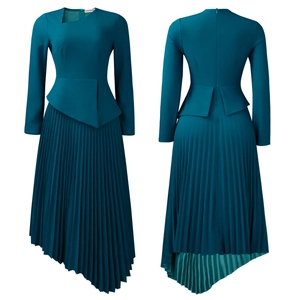 Detail of elegant peacock blue dress featuring asymmetric peplum and pleated high waist