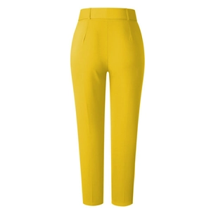 Detail of high-waisted yellow trousers showing professional crease and tailored waist