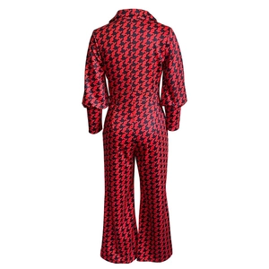Back view of high waist jumpsuit featuring red and black houndstooth pattern print