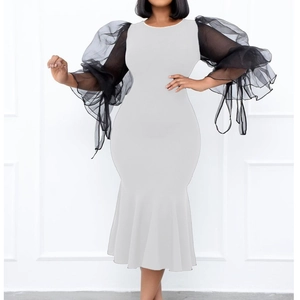 Slim fit black and white mermaid dress with sheer puff sleeves and ruffle detailing