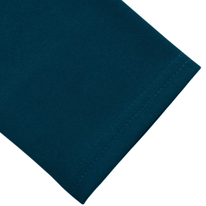 Close-up detail showing double-needle stitching on dark teal knit fabric hem and cuff
