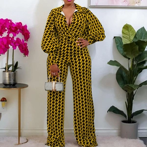 Women's V-neck jumpsuit with yellow houndstooth pattern, puff sleeves and belted waist