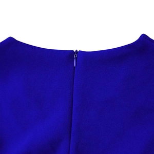 Detailed view of the invisible back zipper on this deep royal blue v-neck pleated dress