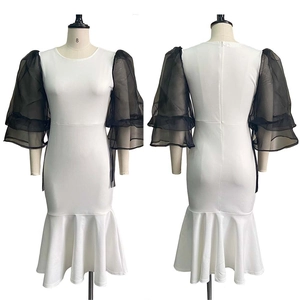 Detail showing the sheer mesh puff sleeves and ruffled cuffs of the mermaid dress