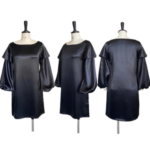 Detail view of black satin dress featuring bubble sleeves and elegant ruffles in three angles