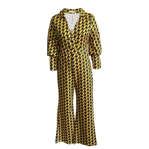 Detail view of the yellow houndstooth wrap front jumpsuit with V-neck and wide legs