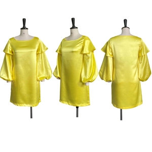 Three-way view of yellow satin dress featuring layered ruffle bubble sleeves and round neck