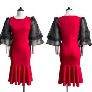 Front and back view of red mermaid dress with black mesh ruffled puff sleeves