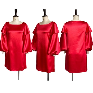 Three-way view of red satin dress with balloon sleeves and ruffle details