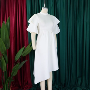 Macro shot of tiered ruffle sleeves and elegant stand collar on white summer dress