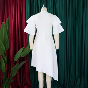 Close-up of white summer dress featuring layered ruffle sleeves and back hidden zipper
