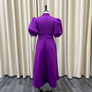 Back view of elegant purple high-waisted maxi dress with puff sleeves and stand collar