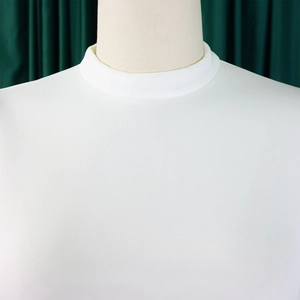 Detailed close-up of the elegant white mock neck and double-layered trim of the summer dress