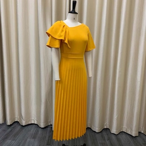 Detailed view of the ruffle shoulder design and pleated texture on this yellow dress