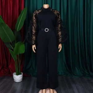 Elegant black jumpsuit with long sheer lace sleeves and sparkling rhinestone belt detail
