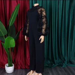 Elegant black jumpsuit featuring high neck and sheer floral embroidered mesh puff sleeves