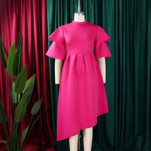 Detail of double-layer ruffle sleeves and fitted waist on magenta evening dress