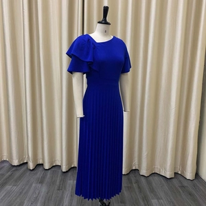 Royal blue pleated dress detail showing asymmetrical neckline and ruffle sleeve