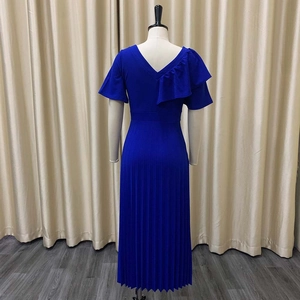 Detail of royal blue V-neck pleated maxi dress featuring elegant ruffle shoulder design