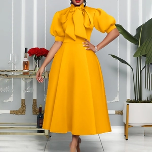 Elegant bright yellow mid-length dress with large bow tie neck and puff sleeves for gala events