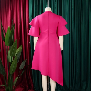 Detailed back view of hot pink dress with double-layered ruffle sleeves and high-low hem